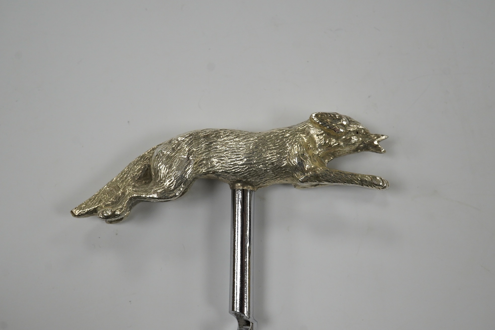 An Elizabeth II novelty silver corkscrew, the handle modelled as a running fox, J.B. Chatterley & Sons, Birmingham, 1968, fox length 85mm. Condition - good